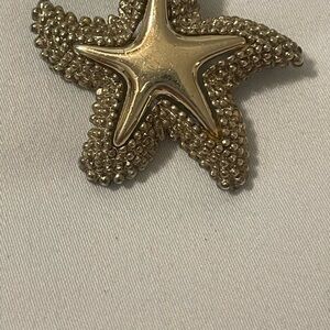 Elegant Gold tone Starfish pendant